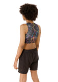 back side view of Kali, who has high-sitting A cups, modeling the Active Top in the nearly sold-out Paint Splatter print