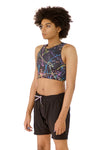 front  side view of Kali, who has high-sitting A cups, modeling the Active Top in the nearly sold-out Paint Splatter print