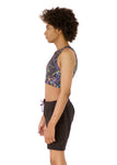 side view of Kali, who has high-sitting A cups, modeling the Active Top in the nearly sold-out Paint Splatter print