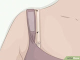 wikiHow image of fashion tape being used to keep a bra strap under a tank top strap